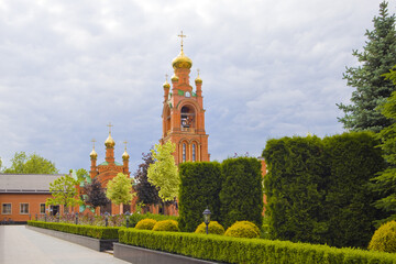 Fototapeta na wymiar Bell tower of Holy Intercession Holosiivsky Monastery in Kyiv, Ukraine 