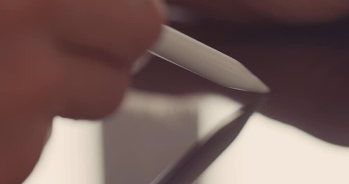 Designer sketching with digital stylus on graphics tablet 