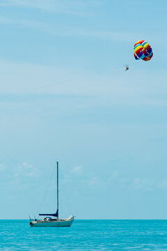 Rainbow parachute on the background of the blue sea and sky. Landscape. Summer. Vacation.