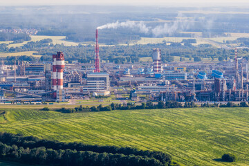 aerial view on pipes of chemical enterprise plant. Air pollution concept. Industrial landscape environmental pollution waste of thermal power plant