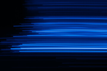 Blur glowing lines. Futuristic neon light. Cyber laser illumination. Defocused fluorescent navy...