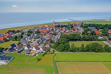 Fototapeta na wymiar Aerial from the traditional village Wierum at the Wadden Sea in Friesland the Netherlands