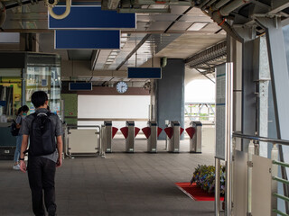 Passengers are walking to buy tickets in electronic Entrance gate card Access Building Security system.