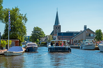 Cruising through the traditional village Warten in Friesland the Netherlands