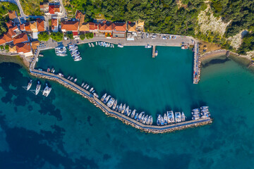 Small marina with catamaran yachts and sailboats in Greece. Kalamos Marina. Beautiful and cozy...