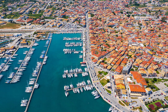 Lefkada, Greece. Aerial view of Lefkada town and marina on the Ionian island. Sailboats in the harbour. Beautiful city on the sea side. Old town. Top view of the marina on coastline. Go Everywhere