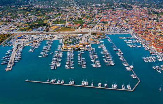 Lefkada, Greece. Aerial view of Lefkada town and marina on the Ionian island. Sailboats in the harbour. Beautiful city on the sea side. Old town. Top view of the marina on coastline. Go Everywhere