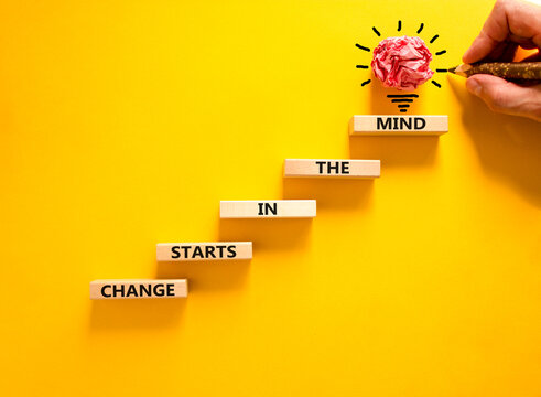 Change starts in the mind symbol. Concept words Change starts in the mind on wooden blocks on a beautiful yellow table yellow background. Business motivational and change starts in the mind concept.