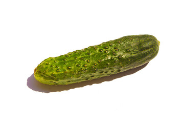 green cucumber lie on a white background
