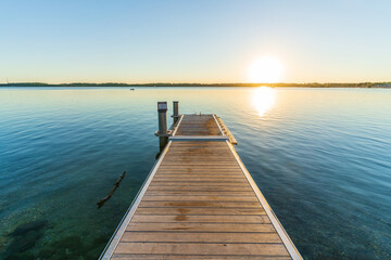 A beautiful sunset behind a jetty at the Cospudener See in summer