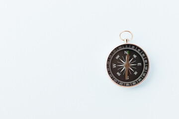 Plakat Vintage compass on light blue background. Journey and adventure concept. Flat lay, top view.