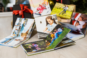photobooks near the New Year tree, colored as a gift for the holiday.
