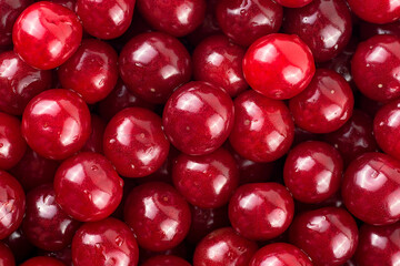 Sweet red cherries as background, top view. Ripe cherries.