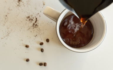 Pouring coffee into a mug