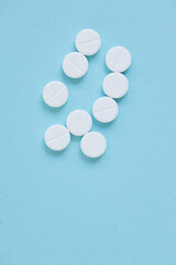 Pills isolated on blue background