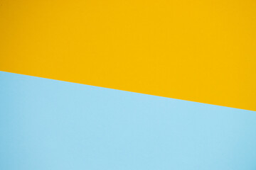 Yellow and blue paper color for background. Geometric pattern, minimalism texture shapes