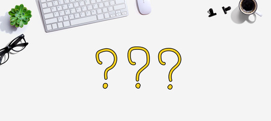 Question marks with a computer keyboard and a mouse