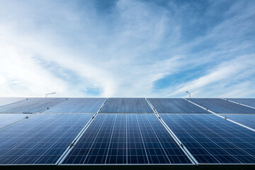Photovoltaic solar power panel on dramatic sunset blue sky background, green clean Alternative power energy concept.