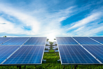 Photovoltaic solar power panel on dramatic sunset blue sky background, green clean Alternative power energy concept.