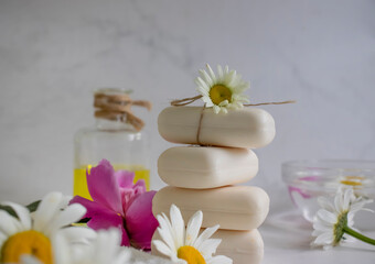 Fototapeta na wymiar Soap cosmetic flower chamomile, peony on a light background