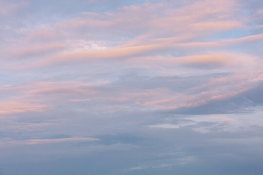 Sky background with pink hues during sunset.