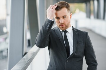 Portrait of a smiling businessman in a modern business environment