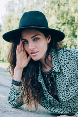 Portrait of beautiful stylish woman wearing black felt hat millennials generation.