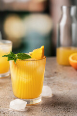 Orange and mint cocktails, soft drinks on bar with text space