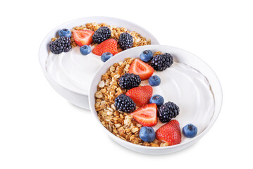 Fresh breakfast with greek yogurt nuts oatmeal granola with berries in a bowl on a white isolated background