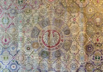 Fototapeta na wymiar Antique woven woolen tapestry with coats of arms patterns 