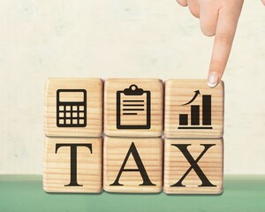 TAX concept, on wooden block  on the desk