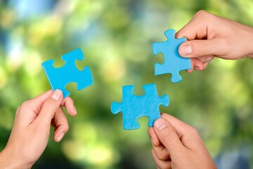 ESG concept of environmental, social, and governance. Hand of people holding a piece of jigsaw puzzle in solving environmental, social