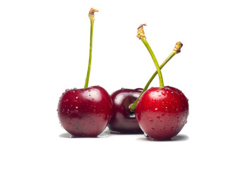 Juicy cherries in water droplets on a white background. Useful food. Beautiful berries isolate. Ripe berries on the table.
