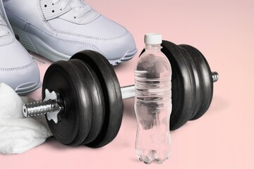 Female fitness sneakers, dumbbells. Feminine sports, workouts, healthy lifestyle.