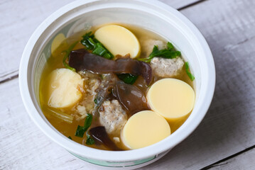 clear soup bowl with pork jelly mushroom black jelly fungus vegetable and celery , vermicelli soup menu healthy food egg tofu soup