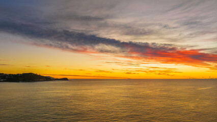 Fototapeta premium Sunrise over the sea with high cloud