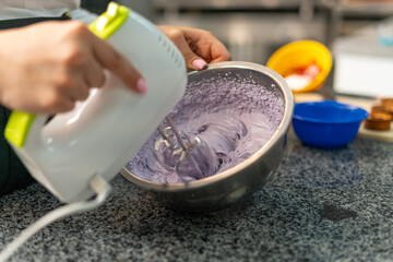 young girl chef makes desserts. bakes sweets and cakes. makes blanks and prepares fruits for the filling. baking, dessert, sweets, complex cooking processes.