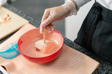 young girl chef makes desserts. bakes sweets and cakes. makes blanks and prepares fruits for the filling. baking, dessert, sweets, complex cooking processes.