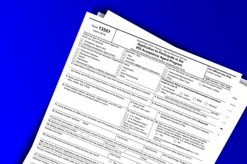 Form 13551 documentation published IRS USA 43805. American tax document on colored - obrazy, fototapety, plakaty