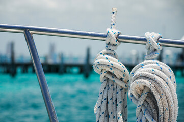 Tied ropes on a sailboat going from Isla Mujeres towards Cancun, Quintana Roo, Mexico
