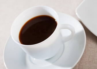 Image of cup of fresh black coffee americano on table, no people