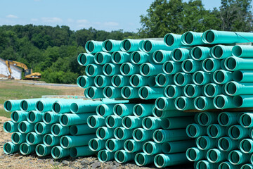 piles of concrete pipes for transporting water and sewerage