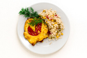 A portion of meat baked under cheese with tomatoes, herbs and rice with vegetables. White isolated background for design for your menu. Copy space.
