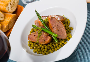 Duck breast with green pea and asparagus. High quality photo