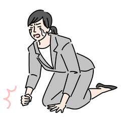 ひざまづいて涙を流して悔しがっているスーツを着た女性
