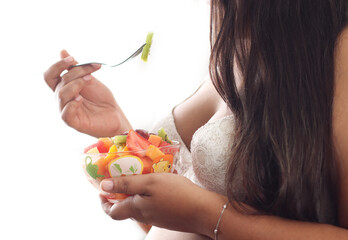 Pregnant woman eating fruits white background, Close up, Space for text