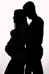 Pregnant silhouette with husband on white background, studio