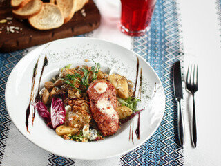 Meat with vegetables on the white plate
