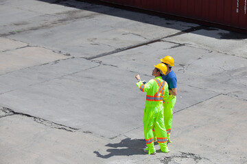 Join the construction work to discuss the construction site plan. Two experts inspect commercial building construction sites