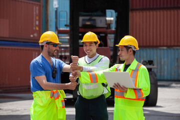 Manager standing and meeting with his staff in container depo company area. worker working checking at Container cargo harbor to loading containers.